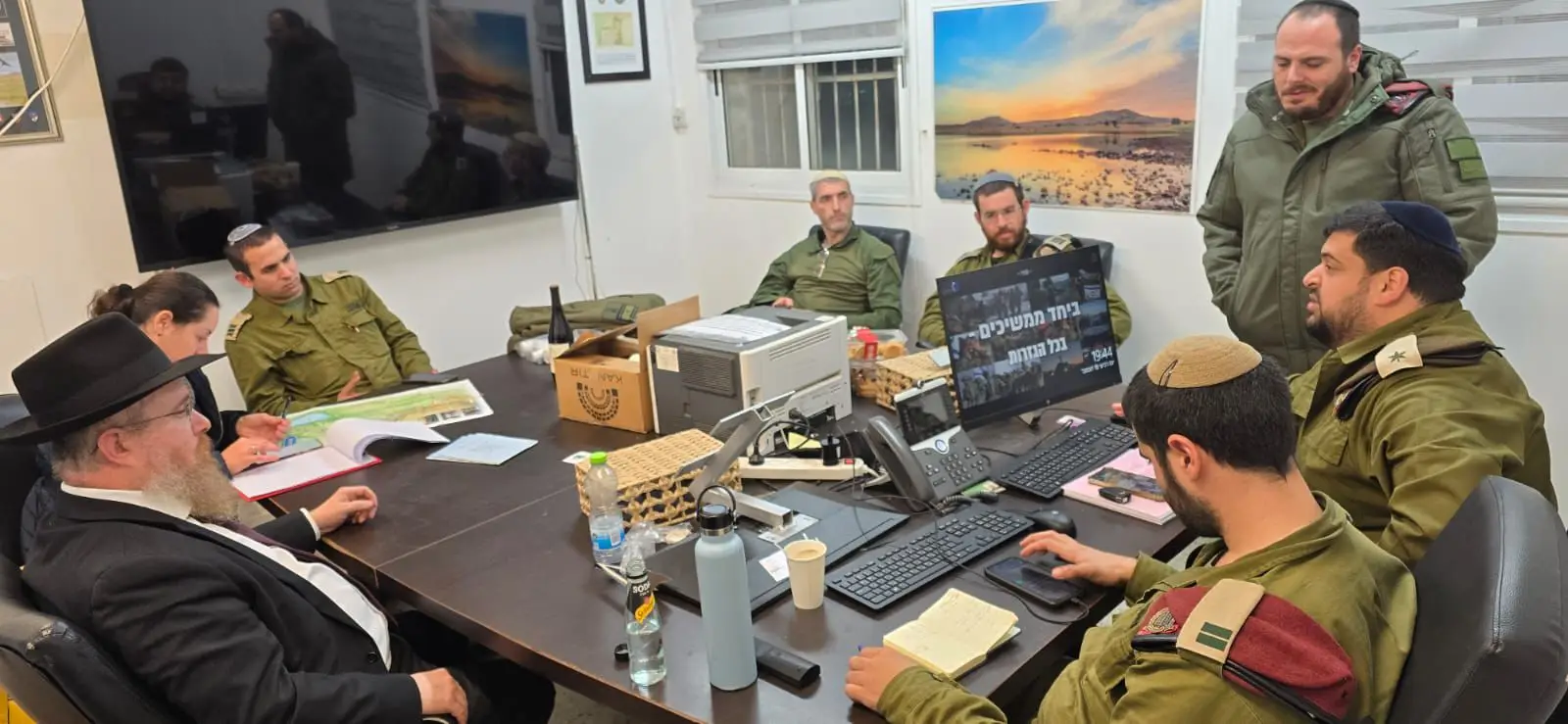Pictured: IDF commanders ask Rabbi Hertzel to help them bring Chanukah to every soldier in the Golan Heights